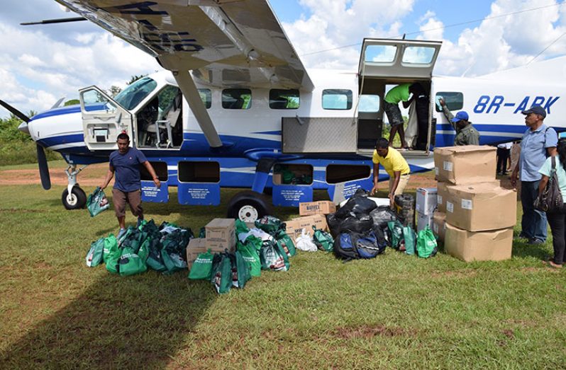 Relief supplies being handed over to the village