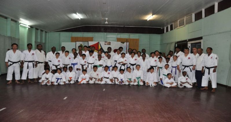 Disciplined students share a moment with Sensei Frank Woon-A-Tai at the International Karate Diagahu.