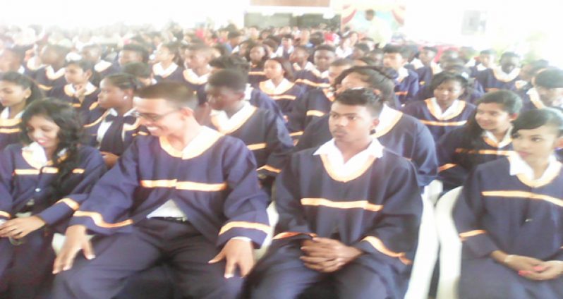 A section of the beaming graduating class