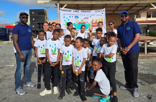 Some of the pupils who participated in Sunday’s walk. Also pictured at right is Head of the Investigations and Enforcement Department at the Environmental Protection Agency (EPA), Mr. Surjpaul Singh