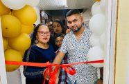 Avishkar Deonarine and Acting Mayor Lorna Fitzallen cut the ribbon to officially open the studio