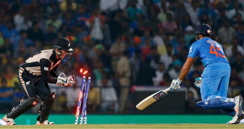 Prolific opening batsman Rohit Sharma is stumped for 5 in the third over as New Zealand's spinners began to choke the home side.