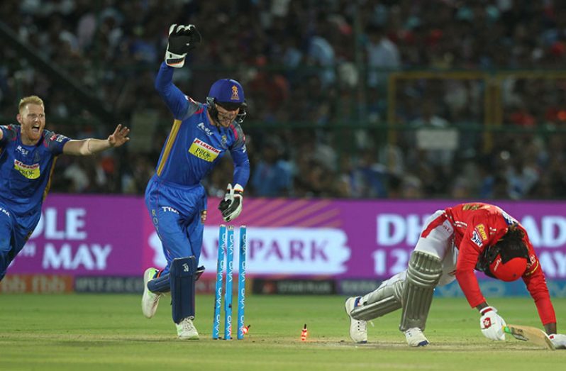 England team-mates Jos Buttler and Ben Stokes erupted in celebrations after Chris Gayle was stumped ©BCCI