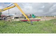 Photos of trenches being cleaned in the community of Success, East Coast Demerara