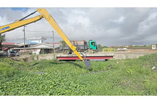 Photos of trenches being cleaned in the community of Success, East Coast Demerara