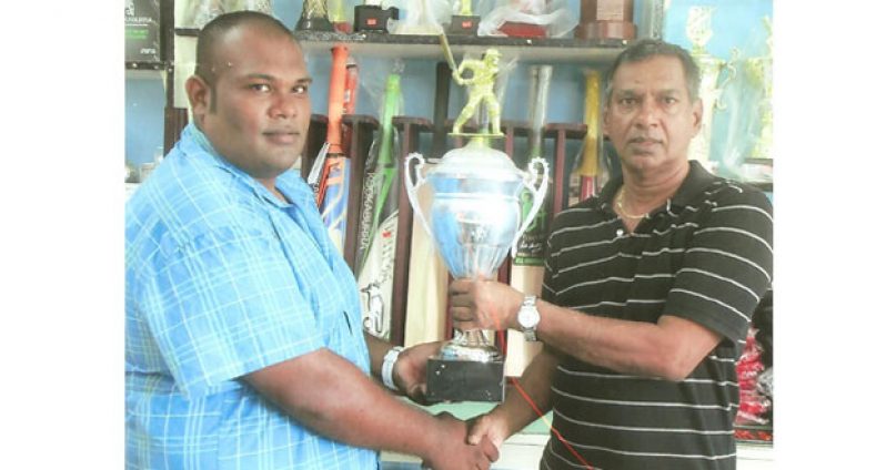Trophy Stall boss Ramesh Sunich hands over trophy to Moonish Singh.