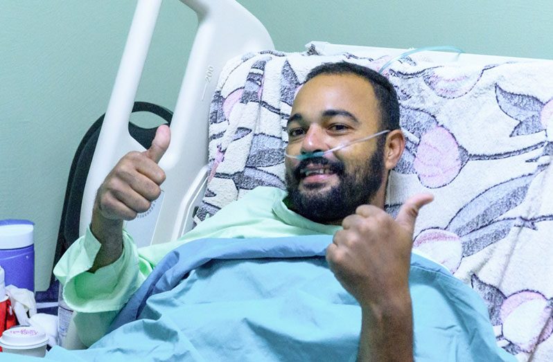 Christopher James smiles from his hospital bed one week post operation with renewed gratitude for life