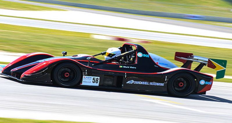 Mark Vieira races in his Suzuki Radical SR3 car and sports the Golden Arrowhead.