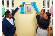 Minister of Education, Priya Manickchand, and Minister of Local Government and Regional Development, Nigel Dharamlall, unveil a plaque at the newly commissioned school (Ministry of Education photos)