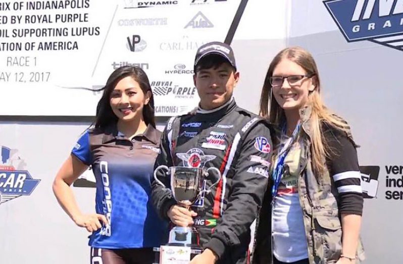 Calvin Ming poses with his Cooper Tyres USF2000 third-place trophy following round five of the series.