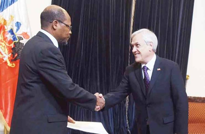 President of Chile, President Piñera (right) accepts the Letters of Credence from Guyana’s Ambassador to that country, Mr. George Talbot