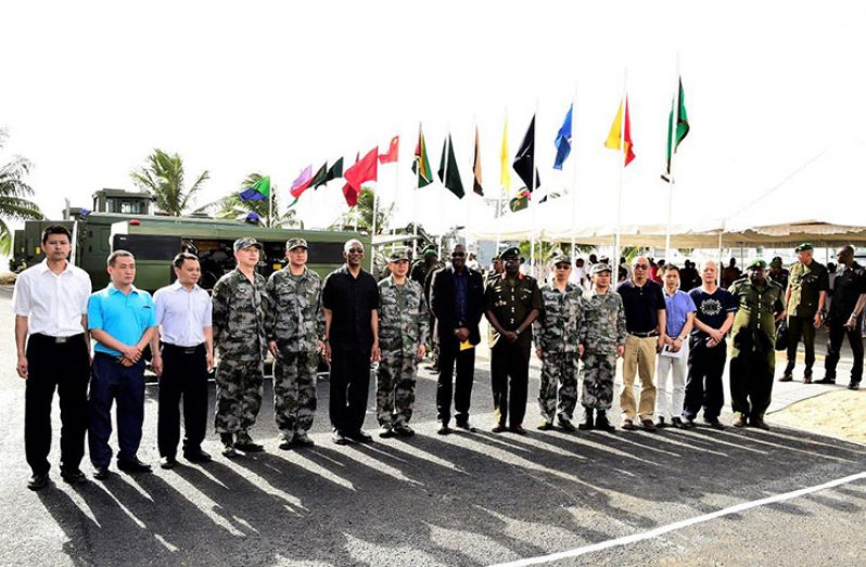 President David Granger poses with technical and military officers of the Chinese People's Liberation Army. To his right are leader of the technical team,Senior Colonel Zeng Xianglin;Minister of Public Infrastructure, Mr. David Patterson and Inspector General of the GDF Colonel Nazrul Hussain.