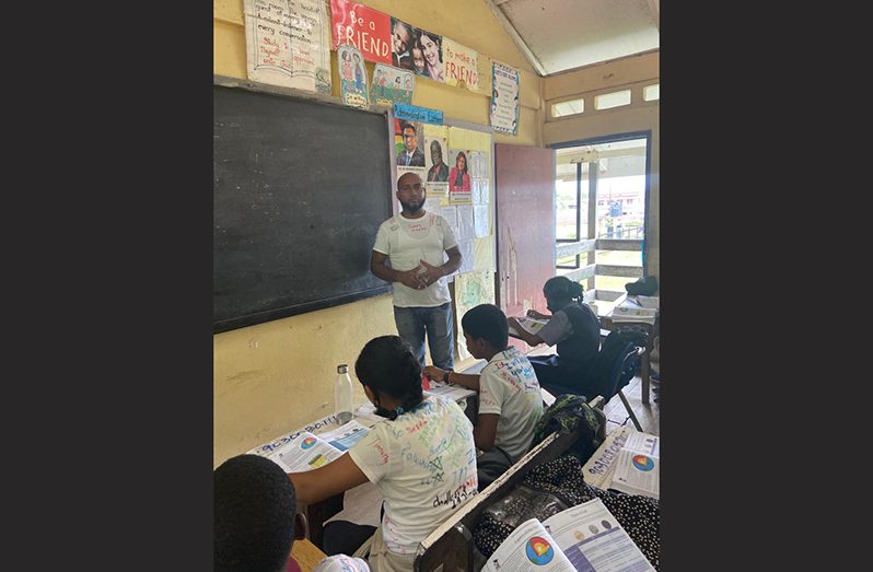 Grade Six teacher, Ronwick Lopes, doing final NGSA preparations with his pupils