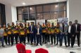The members of the victorious Guyana Harpy Eagles team with Minister of Sport Charles Ramson