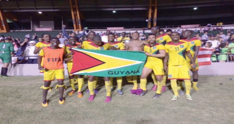 The victorious Golden Jaguars football team celebrate after beating Puerto Rico on Tuesday evening.