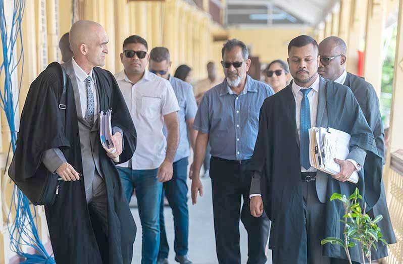 Nazar and Azruddin Mohamed accompanied by their legal team