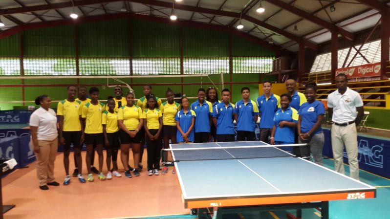Guyana (left) and Suriname table tennis players and their officials following yesterday's matches at CASH.