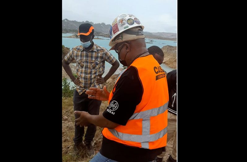 Bosai Minerals Inc. engineers during their inspection of the mines following a breach of the tailings pond