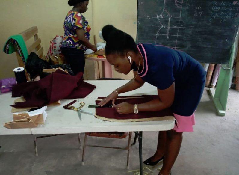 A participant practising the art of dress-making
