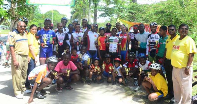 Winners of the various categories of yesterday’s CIDI 11-race cycle programme in the National Park strike a pose with the sponsor’s Sales and Marketing Manager Alisia Katideen (second left) and race organiser Hassan Mohamed, extreme left. (Photos by Adrian Narain)