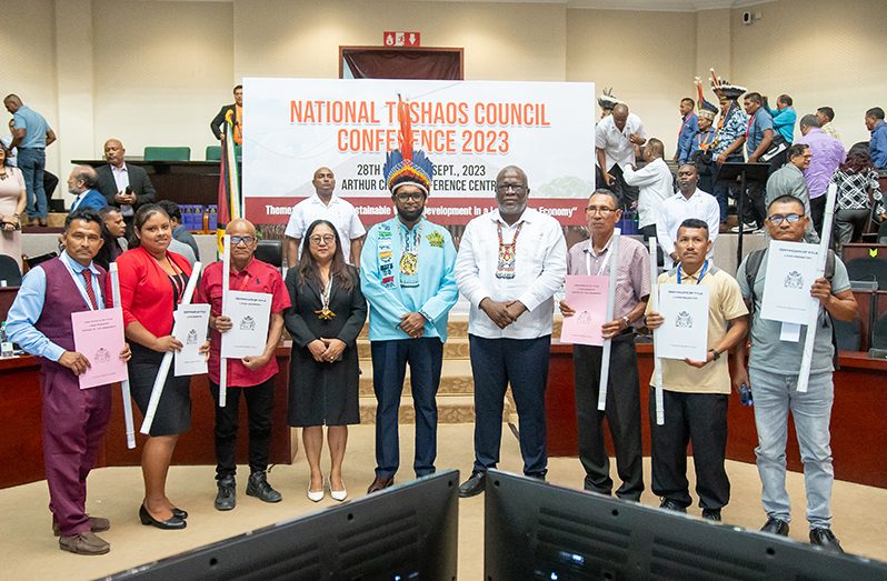 President, Dr. Irfaan Ali; Prime Minister, Brigadier (Ret'd) Mark Phillips and the six toshaos with their certificates of title (Delano Williams photo)