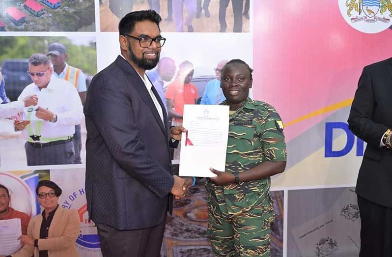 President Dr. Irfaan Ali presented Land Titles, Thursday evening, to a number of allottees following the opening of International Building Expo 2024. (CPHA photo)