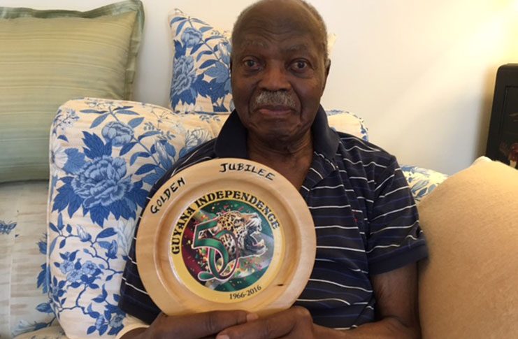 E.R Braithwaite with Guyana Jubilee Year Plaque, Made in Guyana (Francis Quamina Farrier photo)