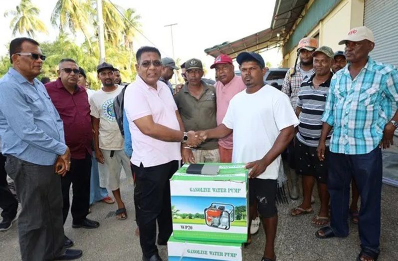 Minister of Agriculture Zulfikar Mustapha handed over farming implements to Bloomfield farmers on Saturday