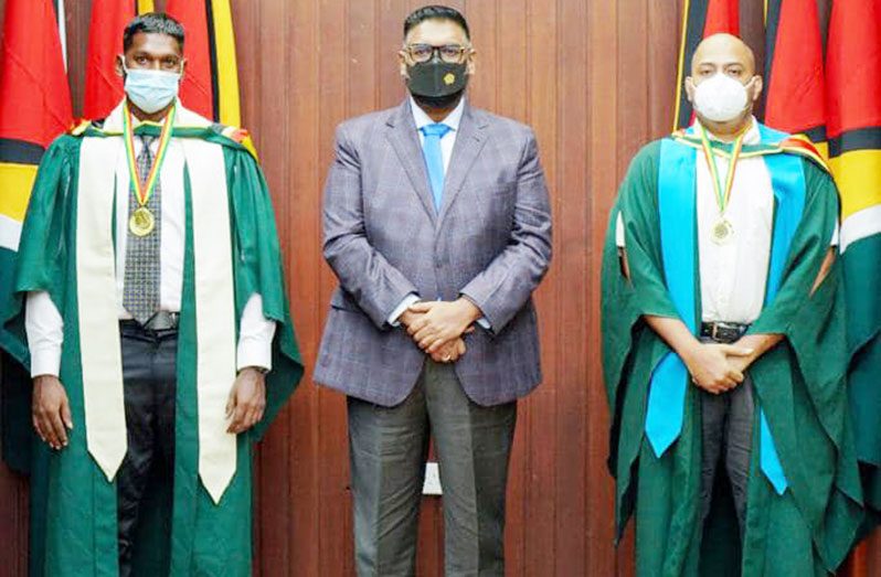President, Dr Irfaan Ali with UG’s Valedictorian Devindra Kissoon and Best Graduating Student of the Berbice Campus Tomeshwor Mohabir from the Tain campus. They both finished with GPAs of 4.0 (Office of the President photo)
