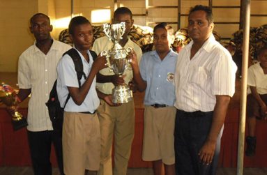 Members of the victorious NAMS team pose with their championship trophy