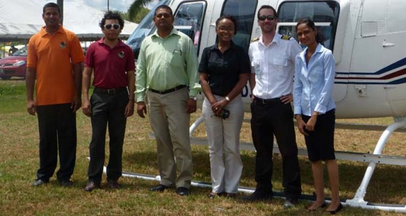 Mr. Haralsingh third from left, with GTA staff and Cpt. Francois Le Blanc