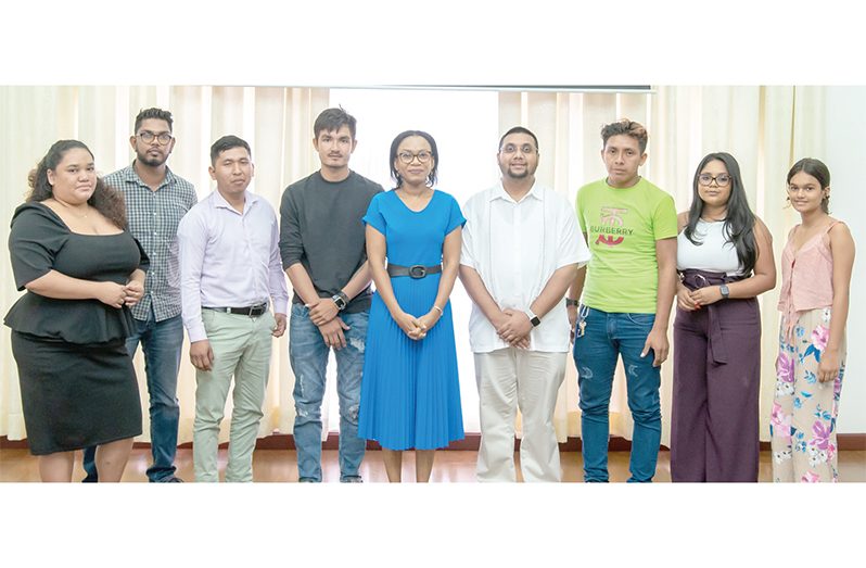 Minister of Tourism, Industry and Commerce, Oneidge Walrond, and Director of the Guyana Tourism Authority, Kamrul Baksh, along with the winners of the Village Video Contest