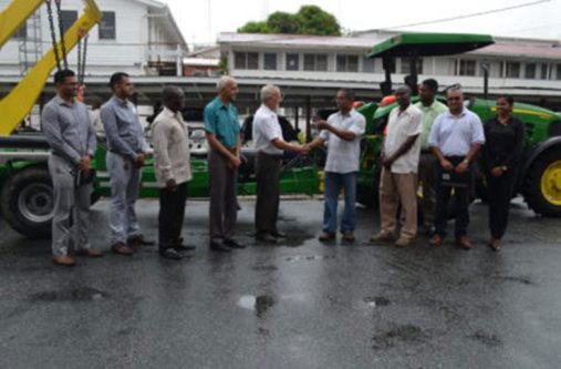 L-R Permanent Secretary of the Ministry of Communities, Emil Mc Garrell; Minister of Communities, Ronald Bulkan; Genequip Chief Executive Officer (CEO), Renger Van Dyk hands over the keys to the Region Eight Regional Executive Officer (REO) (ag), Gavin Gounga, and other officials