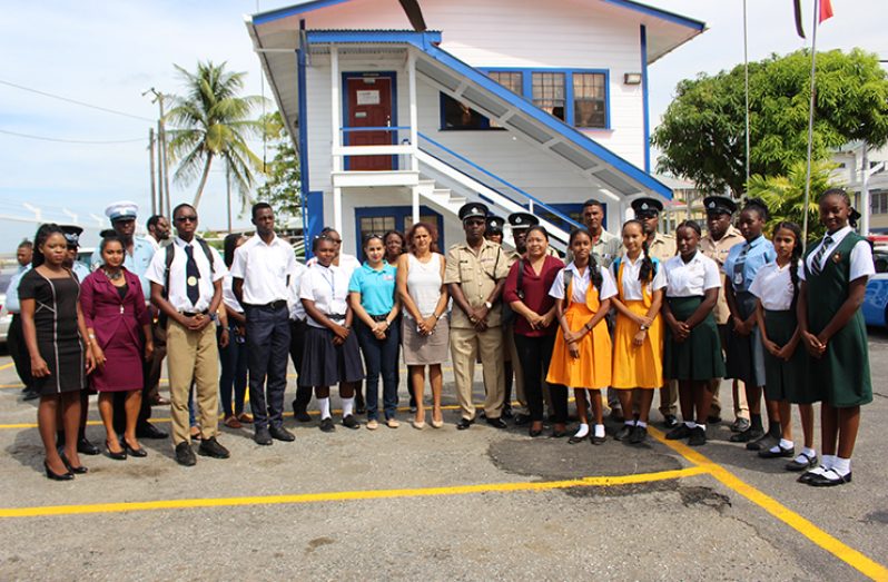 Traffic Officer Supt. L. Isle standing with the Guyana Road Safety Council Coordinator, Ms. Ramona Doorgen and other officials