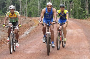 Aubrey Bryce (centre) with one of Guyana’s top riders, Geron Williams and daughter Samantha during. Part of a crew that rode the trail to Lethem in 2011.