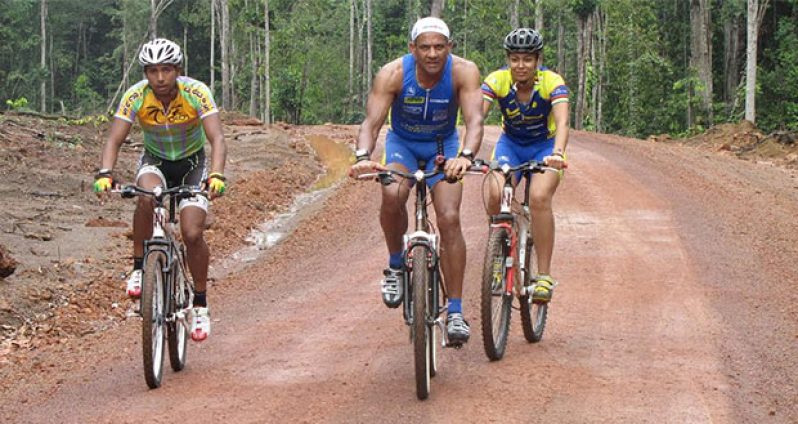 Aubrey Bryce (centre) with one of Guyana’s top riders, Geron Williams and daughter Samantha during. Part of a crew that rode the trail to Lethem in 2011.