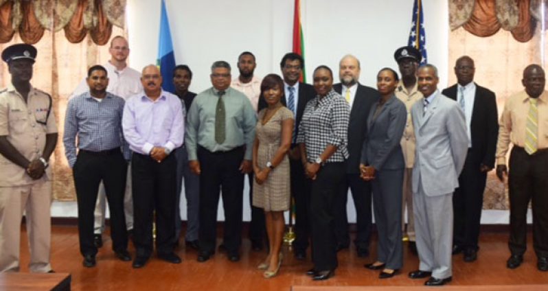 United States Ambassador Perry Holloway (sixth left) and Minister of Public Security Khemraj Ramjattan (at his left) with local security and other officials