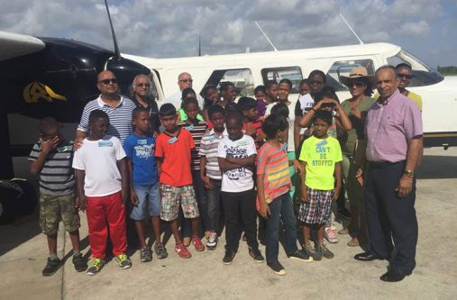 trip Private sector officials with children of the Joshua House Orphanage