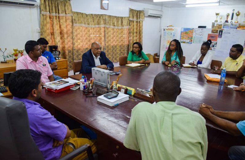 Minister of Natural Resources Raphael Trotman, meeting with staff of the GUYSUCO Training Centre