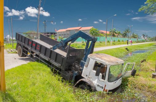 The lorry in the drain at the junction of Mandela and Homestretch Avenues. (Samuel Maughn photos)
