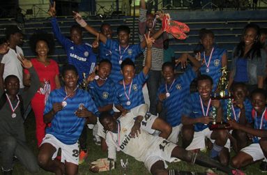 Under-16 champions Uitvlugt display their silverware.