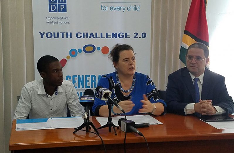 The head table at the launch of 2020 GenU youth Challenge. From left are: UNDP Resident Representative, Jairo Valverde;  UNICEF Country Representative, Sylvie Fouet;  and Rights of the Child Commission Youth Ambassador-Guyana, Jeremy Fraser (Tamica Garnett photo)