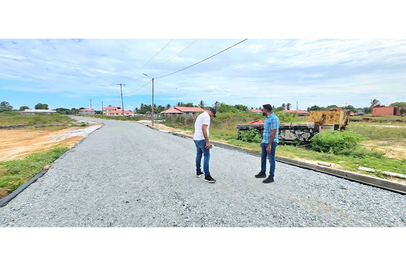 Regional Chairman Devin Mohan and Deputy Regional Executive Officer Omesh Sasenarayan inspecting the road works on Saturday