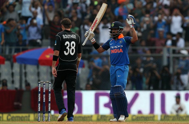 Virat Kohli raises  bat to celebrate r his 31st ODI ton.