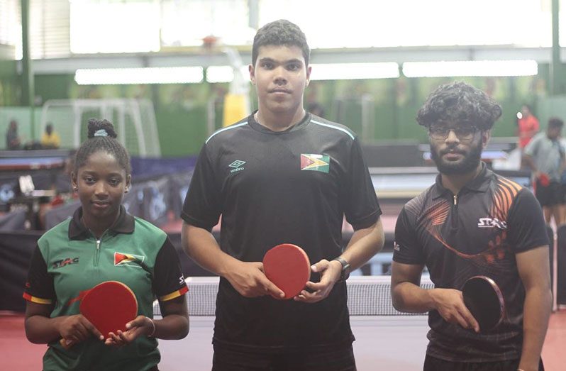 Jonathan Van Lange (middle) won the U19 Mixed Doubles title with Jasmine Billingy (left) and the U19 Boys’ title with Niran Bissu