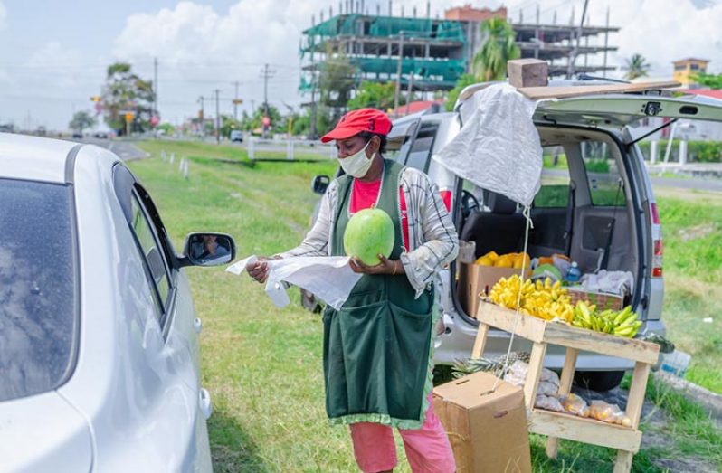 Bibi Ferguson selling one of her customers. – Delano Williams Photo.