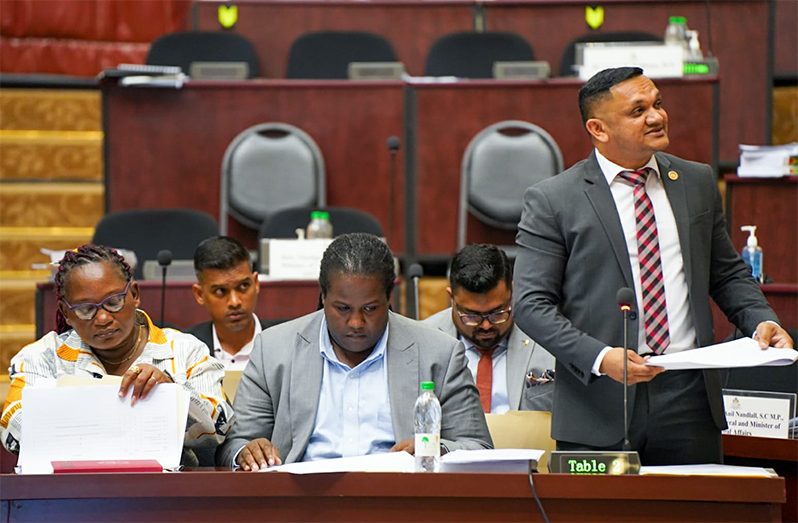 Minister of Natural Resources, Vickram Bharrat, assisted by his team, responds questions during the consideration of the budget estimates on Tuesday (DPI photo)