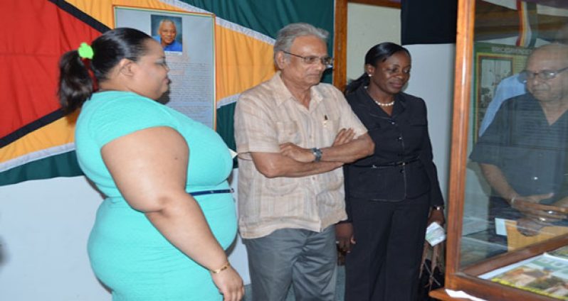 Minister of Education Dr. Rupert Roopnaraine, along with Minister within the Ministry, Nicolette Henry, viewing an item on show at the annual Independence Exhibition at the National Museum