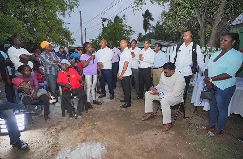 While listening to the concerns of residents, President Ali, flanked by public agency officials, took notes (Office of the President photo)