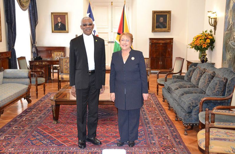 President David Granger and Chilean President Michelle Bachelet pose for a photograph before engaging in talks at the Palacio de la Moneda (MoTP photo)